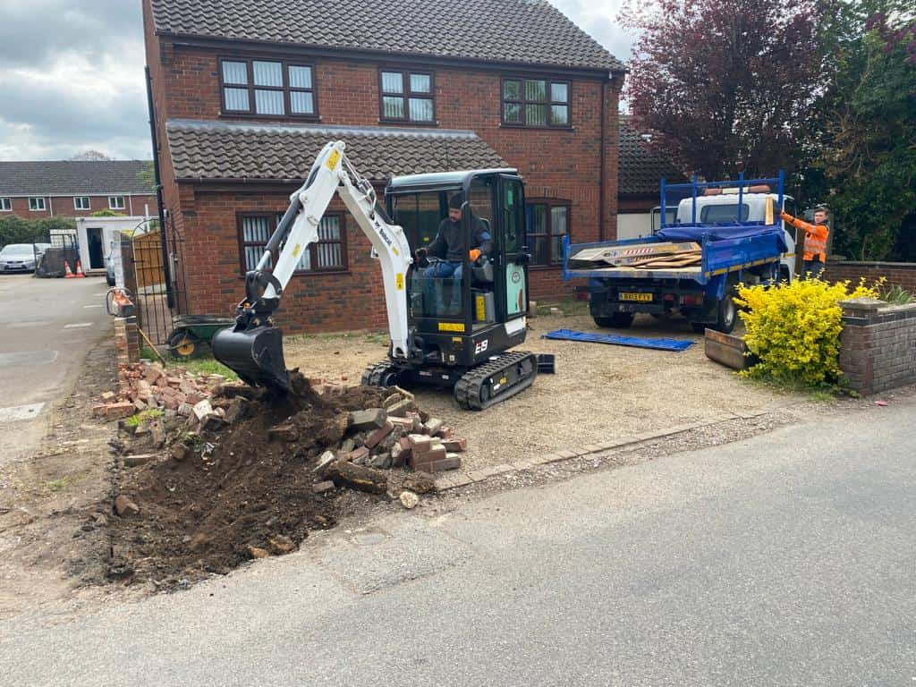 This is a photo of an operative of Sittingbourne Driveways Digging out for a new tarmac driveway